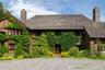 Tudor-style house featuring a chimney