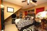 Bedroom featuring light colored carpet and ceiling fan