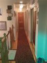 Corridor featuring hardwood / wood-style floors