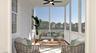 Sunroom / solarium featuring ceiling fan