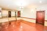 Tiled spare room featuring recessed lighting, wainscoting, a chandelier, tile walls, and elevator