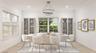 Dining room featuring ornamental molding, light wood-type flooring, and baseboards