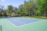 View of tennis court featuring community basketball court