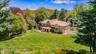 View from above of property featuring a heavily wooded area