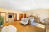 Bedroom featuring light wood finished floors, vaulted ceiling, and recessed lighting