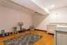 Bedroom featuring wood finished floors and baseboards