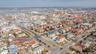 Birds eye view of property with a water view and a view of city
