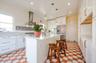 Large Kitchen featuring professional style gas range kitchen island with  prep sink, and stainless steel refrigerator with ice & water dispenser