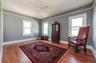 Large 2nd floor bedroom with a ceiling fan, and hardwood floors