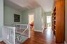 Large and gracious 2nd floor landing leading to 5 large bedrooms. Hardwood floors, bookshelves and attic access