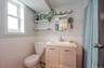 Full Bathroom featuring wainscoting tile walls, and vanity