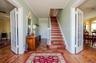 Formal Entry Foyer, Stairway with french doors to LR & DRs, custom inlaid marquetry floors, crown molding