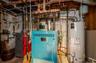 Utility room with gas heating unit and water heater