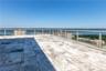 View of patio with a water view