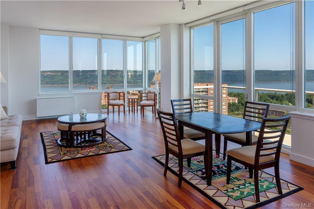 Sunroom / solarium featuring a water view and radiator