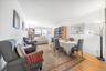 Dining area featuring light wood finished floors and crown molding