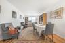 Dining room featuring light wood-type flooring and crown molding