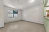 Empty room featuring baseboard heating and a textured ceiling