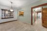 Unfurnished dining area with light tile patterned flooring and a textured ceiling