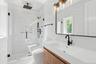 Full bath with vanity and a stall shower