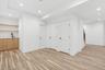 Additional living space featuring recessed lighting and light wood-type flooring