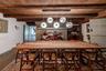 Dining space featuring wooden ceiling with exposed beams