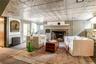Living area with radiator, a fireplace, and an ornate ceiling