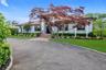 view of Circular Driveway with a front yard