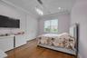 Bedroom featuring wood finished floors, a closet, ornamental molding, a chandelier, and recessed lighting