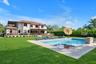 View of swimming pool with a lawn, a patio area, and a pool with connected hot tub