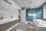 Primary Spa Bathroom with marble tiled flooring, a marble finish shower, a jetted tub, and recessed lighting