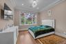 Bedroom with crown molding, wood finished floors, and recessed lighting