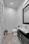 Powder room with vanity and toilet