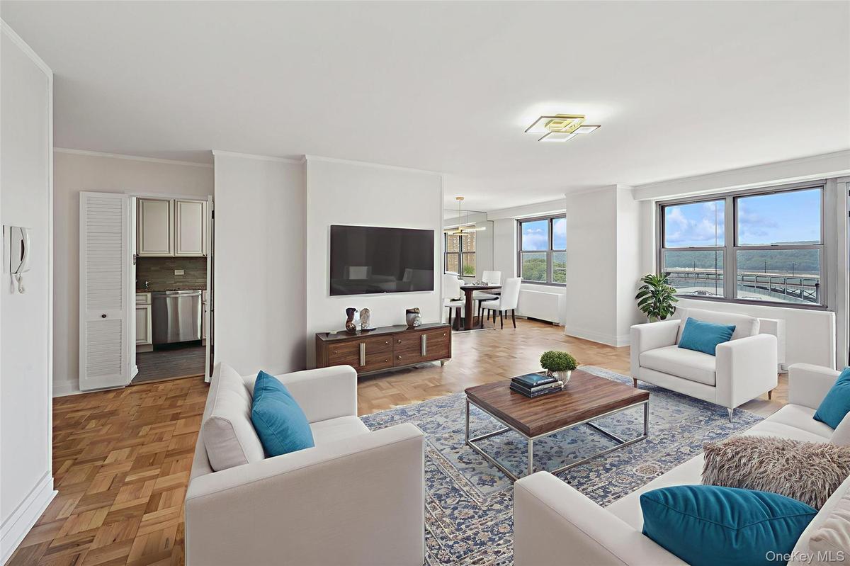 Virtually staged living area with baseboards and ornamental molding