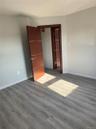 Unfurnished bedroom featuring dark wood-style floors