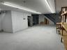 Basement featuring concrete block wall