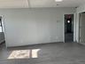 Unfurnished room with wood finished floors and baseboards