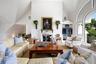 Living room featuring high vaulted ceiling