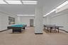 Recreation room with baseboards and pool table