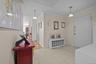 Entryway featuring ornamental molding and light tile patterned floors