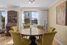 Dining space featuring crown molding, light wood-style flooring, and a chandelier