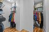 Walk in closet featuring light wood-type flooring