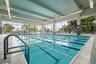 Indoor pool featuring a patio
