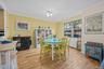 Dining area featuring ornamental molding and light wood-type flooring