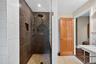 Bathroom featuring a walk in shower and recessed lighting