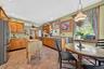 Kitchen featuring stainless steel appliances, hanging light fixtures, recessed lighting, a ceiling fan, and light tile patterned floors