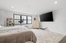 Bedroom featuring baseboards, wood finished floors, recessed lighting, and crown molding