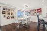 Dining area with wood finished floors, baseboards, ornamental molding, and recessed lighting