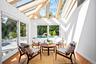 Family room with a skylight, plenty of natural light, and lofted ceiling