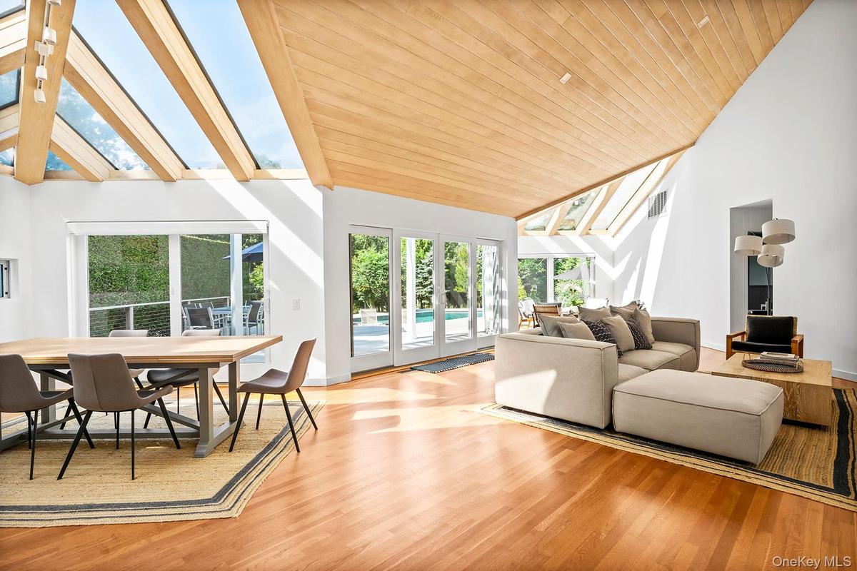 Interior featuring a skylight, high vaulted celings
